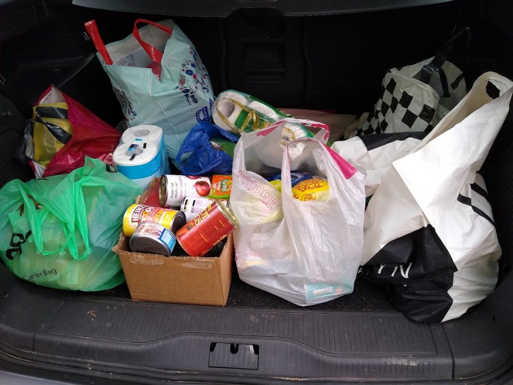 Shopping bags in a car boot.
