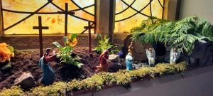 Easter scene in front of stained glass