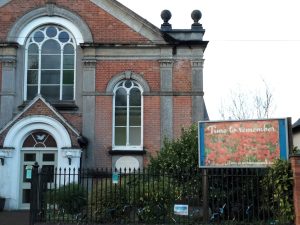 Cores End church and poster board. The poster of poppies has a caption "Time to Remember".